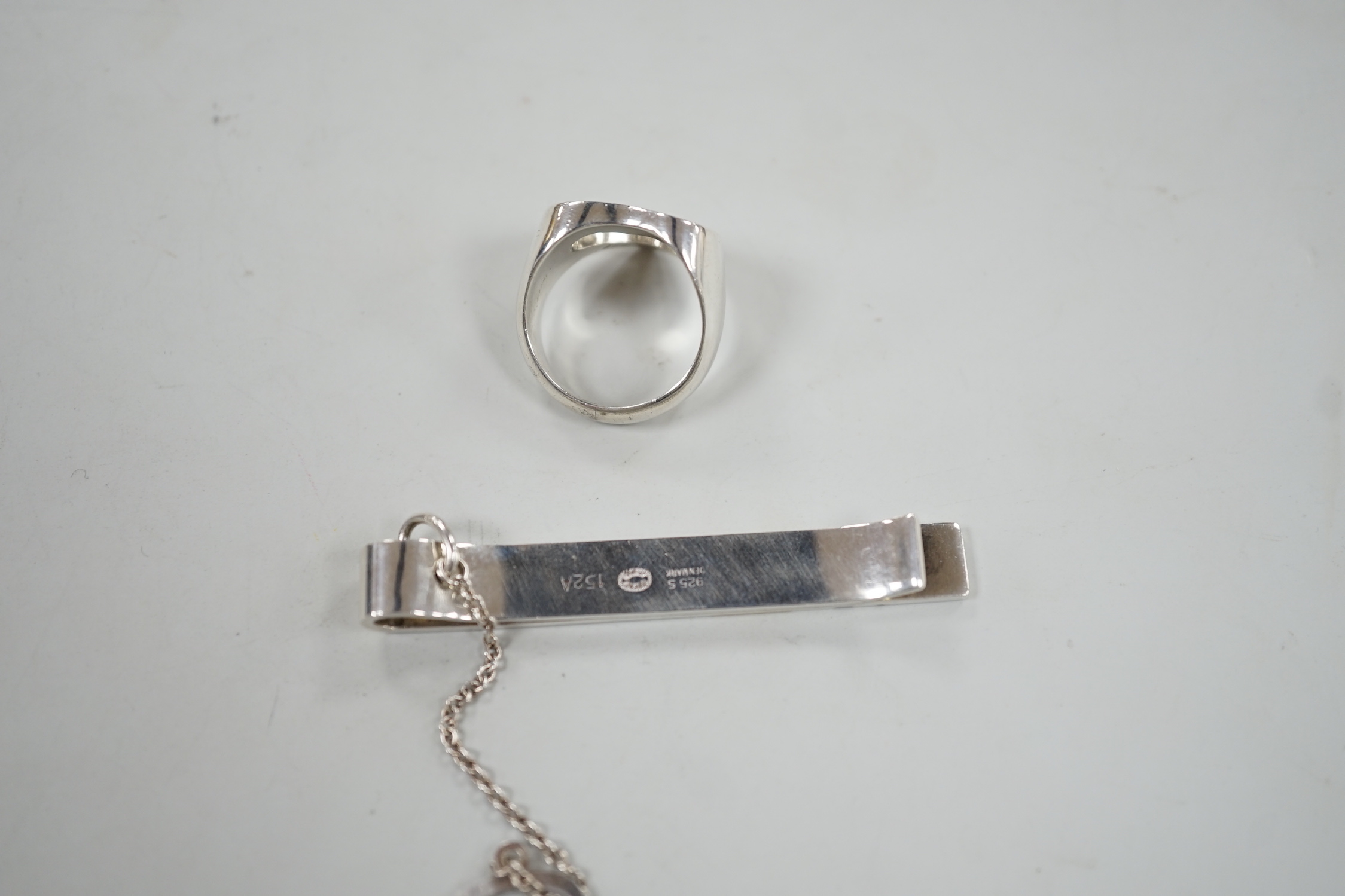 A Georg Jensen sterling pierced heart ring, size N and a Georg Jensen two colour sterling tie clip, design no. 152A, 58mm.